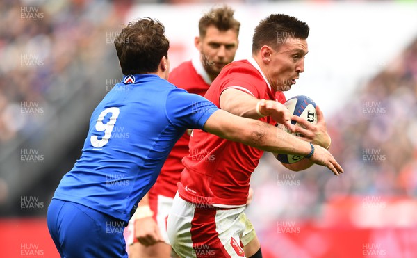 180323 - France v Wales - Guinness Six Nations - Josh Adams of Wales is tackled by Antoine Dupont of France 