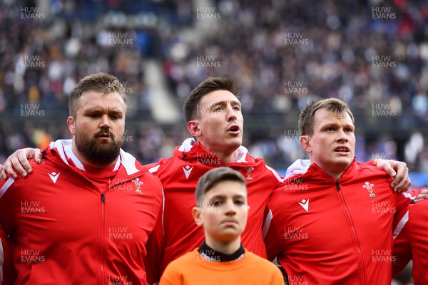 180323 - France v Wales - Guinness Six Nations - Tomas Francis, Josh Adams, Nick Tompkins of Wales during the anthems