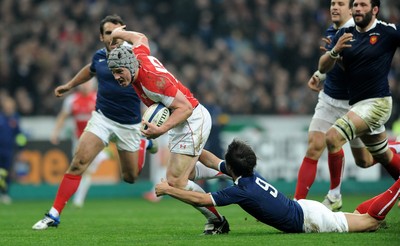 19.03.11 - France v Wales - RBS Six Nations 2011 - Jonathan Davies of Wales is tackled by Morgan Parra of France. 
