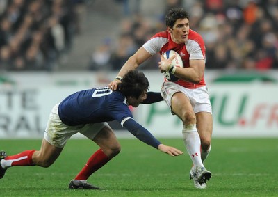 19.03.11 - France v Wales - RBS Six Nations 2011 - James Hook of Wales holds off Francois Trinh-Duc of France. 