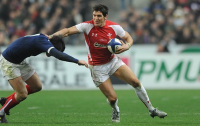 19.03.11 - France v Wales - RBS Six Nations 2011 - James Hook of Wales holds off Francois Trinh-Duc of France. 