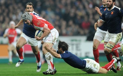 19.03.11 - France v Wales - RBS Six Nations 2011 - Jonathan Davies of Wales is tackled by Morgan Parra of France. 
