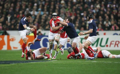 19.03.11 France v Wales ... Wales Ryan Jones is tackled by France's Thomas Domingo. 
