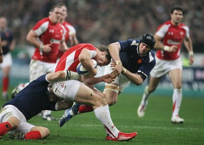 19.03.11 France v Wales ... Wales George North is tackled by France's Julien Bonnaire and France's Damien Traille. 