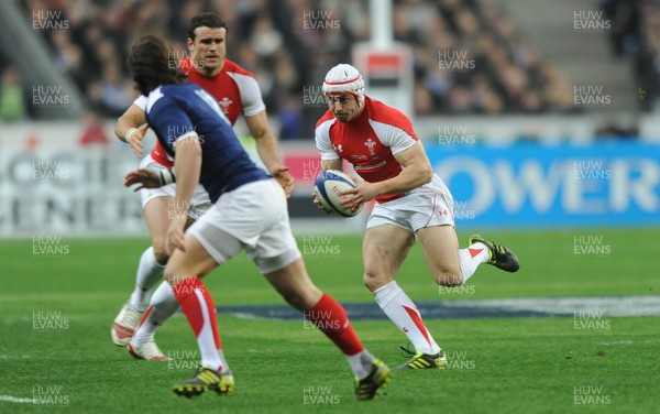 19.03.11 - France v Wales - RBS Six Nations 2011 - Leigh Halfpenny of Wales takes on Alexis Palisson of France. 