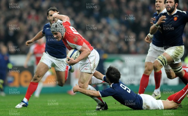 19.03.11 - France v Wales - RBS Six Nations 2011 - Jonathan Davies of Wales is tackled by Morgan Parra of France. 