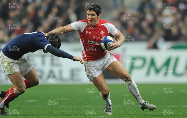 19.03.11 - France v Wales - RBS Six Nations 2011 - James Hook of Wales holds off Francois Trinh-Duc of France. 