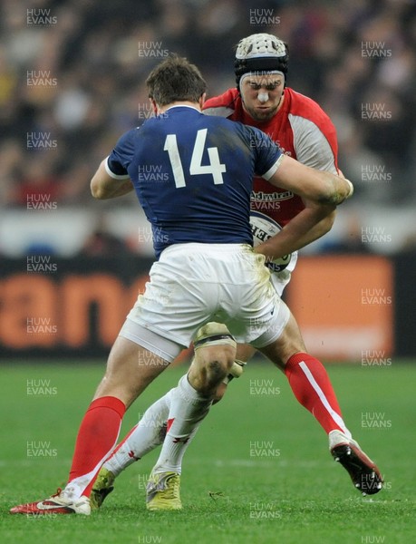 19.03.11 - France v Wales - RBS Six Nations 2011 - Ryan Jones of Wales is tackled by Vincent Clerc of France. 