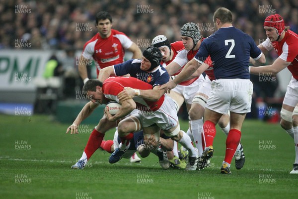 19.03.11 France v Wales ... Wales Sam Warburton is tackled by France's Julien Bonnaire. 