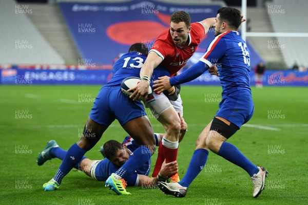 200321 - France v Wales - Guinness Six Nations - George North of Wales is tackled by Virimi Vakatawa and Paul Willemse of France