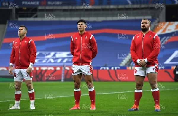 200321 - France v Wales - Guinness Six Nations - Gareth Davies, Louis Rees-Zammit and Tomas Francis of Wales during the anthems
