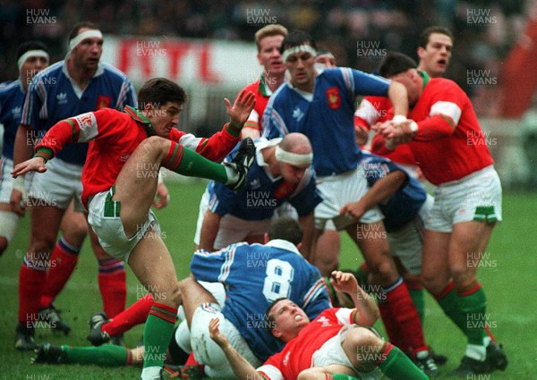 210195 - Wales v France - Five Nations - Robert Jones of Wales clears the ball