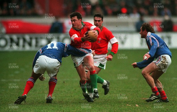 210195 - Wales v France - Five Nations - Simon Hill of Wales is tackled by Philippe Saint-Andre of France