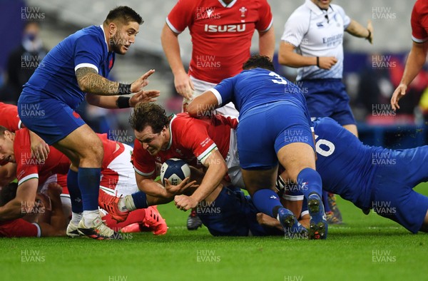 241020 - France v Wales - International Rugby Union - Ryan Elias of Wales is tackled by Mohamed Haouas and Francois Cros of France