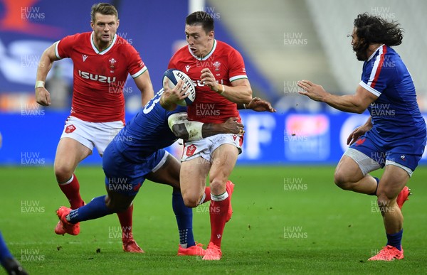 241020 - France v Wales - International Rugby Union - Josh Adams of Wales is tackled by Virimi Vakatawa of France