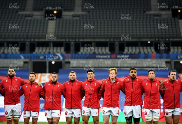 241020 - France v Wales - International Rugby Union - Cory Hill, Rhys Webb, Nicky Smith, Sam Parry, Louis Rees-Zammit, Rhys Patchell, Taulupe Faletau, Justin Tipuric and Ryan Elias during the anthems