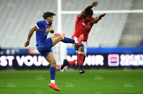 241020 - France v Wales - International Rugby Union - Romain Ntamack of France kicks ahead as Taulupe Faletau of Wales puts on the pressure