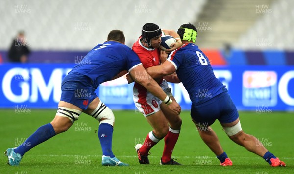 241020 - France v Wales - International Rugby Union - Leigh Halfpenny of Wales is tackled by Paul Willemse and Gregory Alldritt of France