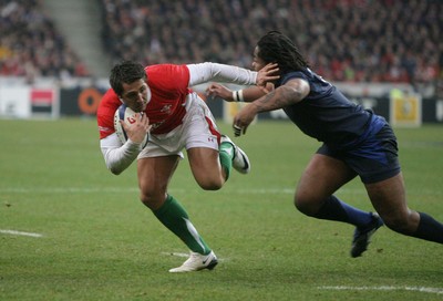 27.02.09 France v Wales... Wales' Gavin Henson is tackled by France's Mathieu Bastareaud. 