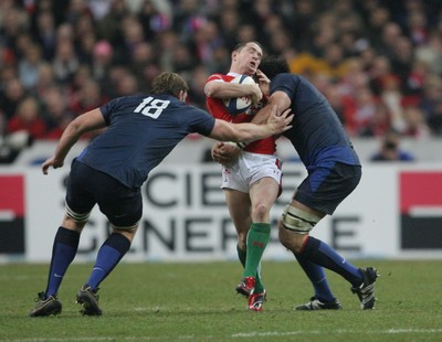 27.02.09 France v Wales... Wales' Shane Williams is rocked by France's Lionel Nallet(lt) and  Romain Millo-Chluski. 