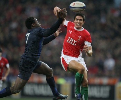 27.02.09 France v Wales... Wales' James Hook and France's Fulgencene Ouedraogo compete for the ball. 