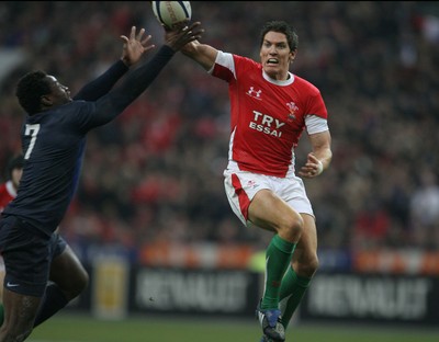 27.02.09 France v Wales... Wales' James Hook and France's Fulgencene Ouedraogo compete for the ball. 