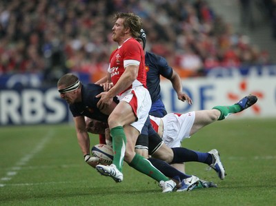 27.02.09 France v Wales... France's Imanol Harinordoquy is tackled by Tom Shanklin and Andy Powell. 