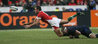 27.02.09 France v Wales... Wales' Lee Byrne is tackled by France's Imanol Harinordoquy. 
