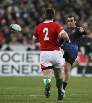 27.02.09 France v Wales... France's Benoit Baby kicks past Matthew Rees. 