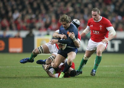 27.02.09 France v Wales... France's Dimitri Szarzewski is tackled by Stephen Jones, Ryan Jones and Gethin Jenkins. 