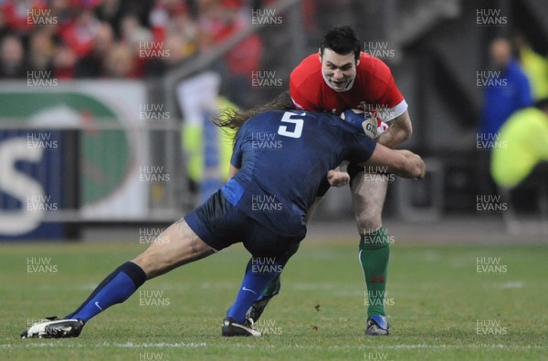 27.02.09 - France v Wales - RBS Six Nations 2009 - Wales' Stephen Jones is tackled by France's Sebastien Chabal. 
