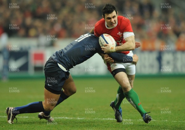 27.02.09 - France v Wales - RBS Six Nations 2009 - Wales' Stephen Jones is tackled by France's Francois Trinh-Duc. 