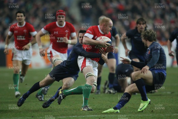 27.02.09 France v Wales... Wales' Martyn Williams is tackled by France's Morgan Parra. 