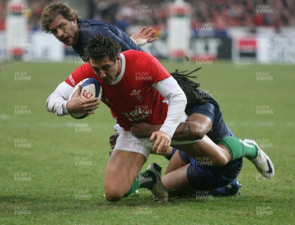 27.02.09 France v Wales... Wales' Gavin Henson is tackled by France's Mathieu Bastareaud. 