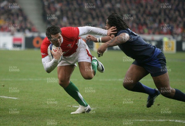 27.02.09 France v Wales... Wales' Gavin Henson is tackled by France's Mathieu Bastareaud. 