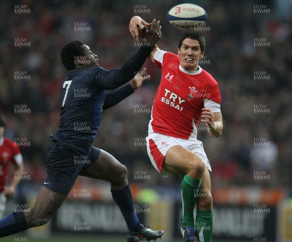 27.02.09 France v Wales... Wales' James Hook and France's Fulgencene Ouedraogo compete for the ball. 