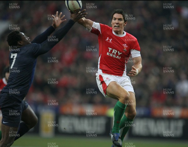 27.02.09 France v Wales... Wales' James Hook and France's Fulgencene Ouedraogo compete for the ball. 