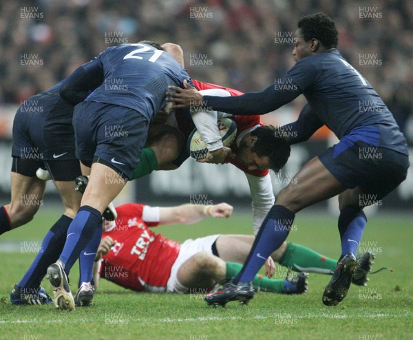 27.02.09 France v Wales... Wales' Gavin Henson is tackled by a trio of French players. 