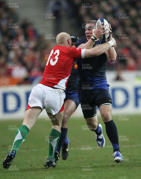 27.02.09 France v Wales... France's Imanol Harinordoquy is tackled by Tom Shanklin. 