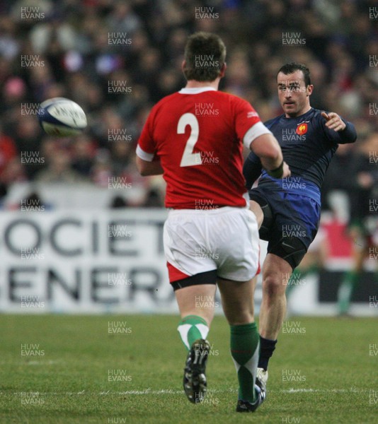 27.02.09 France v Wales... France's Benoit Baby kicks past Matthew Rees. 