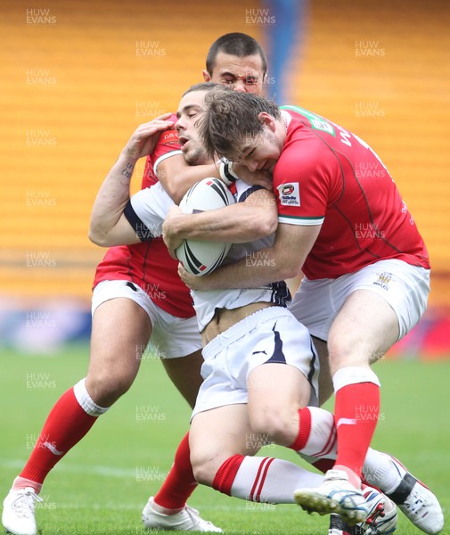 201012 France RL v Wales RLFrance Cyril Stacul is tackled by Wales Ben Evans(rt) and Wales Mike Channing