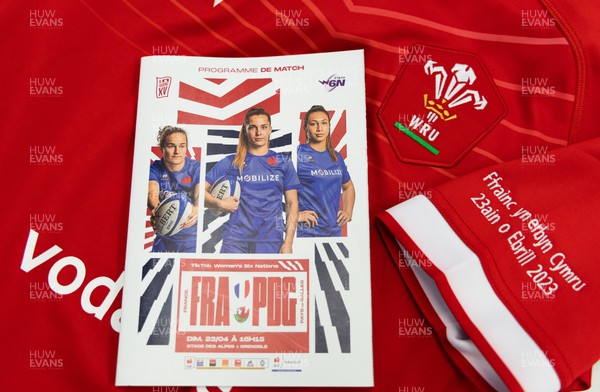 230423 - France v Wales, TicTok Women’s 6 Nations - A Wales match shirt and programme  at the Stade des Alpes ahead of the start of the match