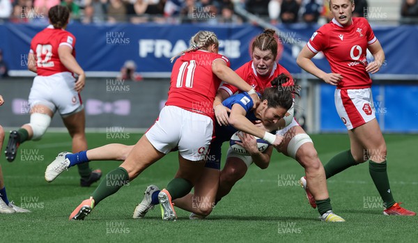 230423 - France v Wales, TicTok Women’s 6 Nations -Jessy Tremouliere of France is tackled by Carys Williams- Morris of Wales and Kate Williams of Wales