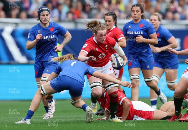 230423 - France v Wales, TicTok Women’s 6 Nations - Abbie Fleming of Wales takes on Gaelle Hermet of France