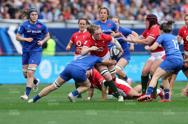 230423 - France v Wales, TicTok Women’s 6 Nations - Abbie Fleming of Wales takes on Gaelle Hermet of France