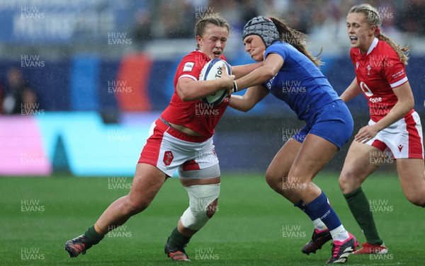 230423 - France v Wales, TicTok Women’s 6 Nations - Lleucu George of Wales is tackled by Melissande Llorens of France