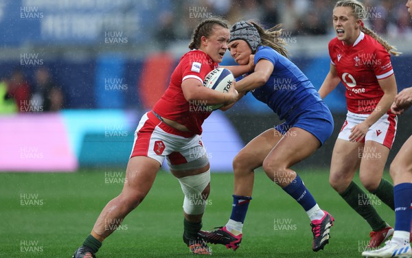 230423 - France v Wales, TicTok Women’s 6 Nations - Lleucu George of Wales is tackled by Melissande Llorens of France