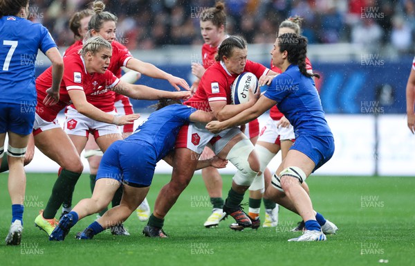 230423 - France v Wales, TicTok Women’s 6 Nations - Lleucu George of Wales takes on Maelle Picut of France