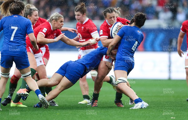 230423 - France v Wales, TicTok Women’s 6 Nations - Lleucu George of Wales takes on Maelle Picut of France