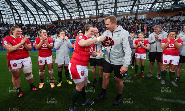 230423 - France v Wales, TicTok Women’s 6 Nations - Abbey Constable of Wales is presented with her first cap by Wales head coach Ioan Cunningham at the end of the match